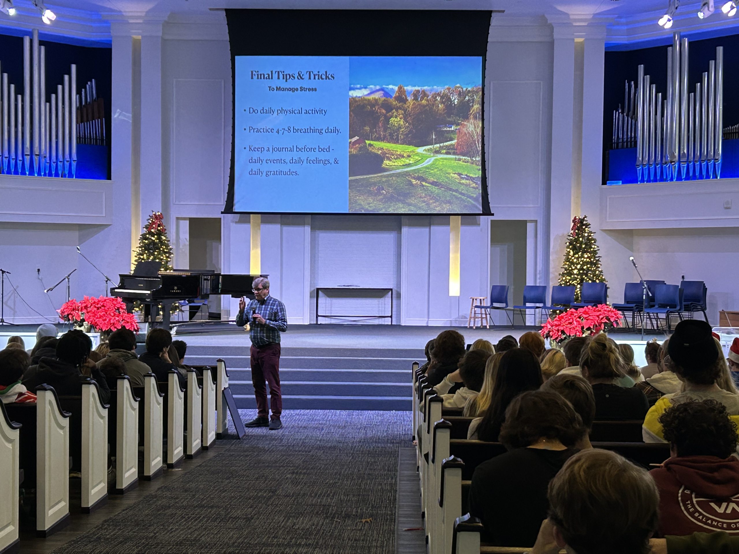 dave speaking about self-care to an audience